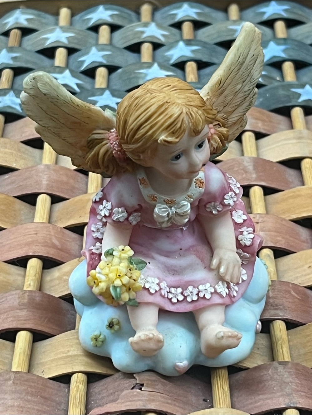 vintage,fairy girl with blond pigtails on cloud  and holding flowers